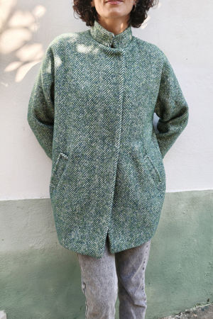 Picture of the "cocoon" coat in green herringbone