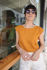 Picture of open back crop top in burnt orange