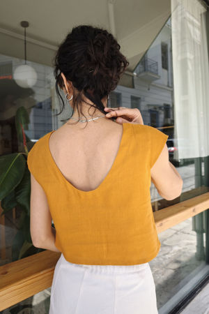 Picture of open back crop top in burnt orange